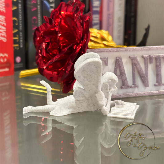 3d printed figurine of a fairy reading a book