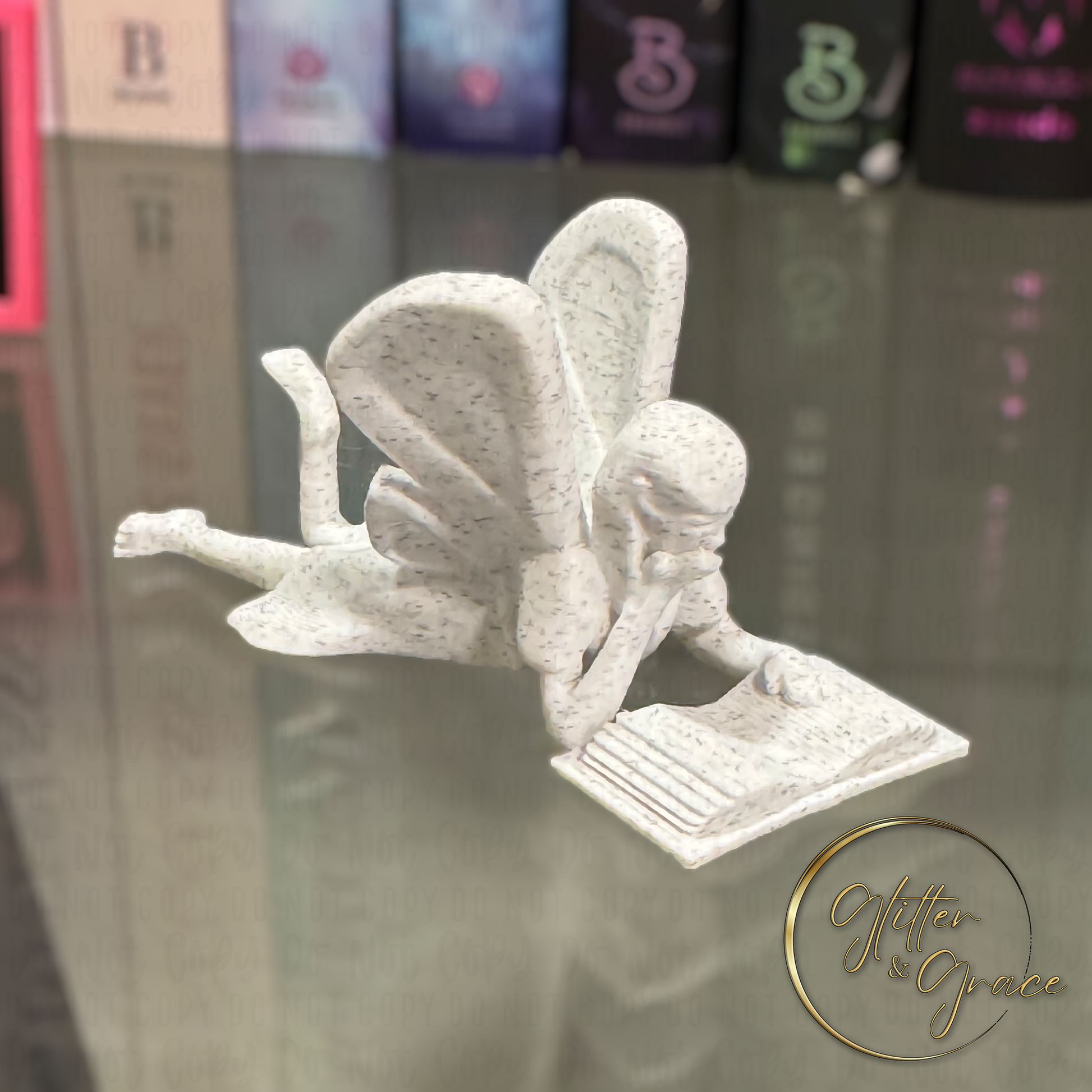 3d printed figurine of a fairy reading a book