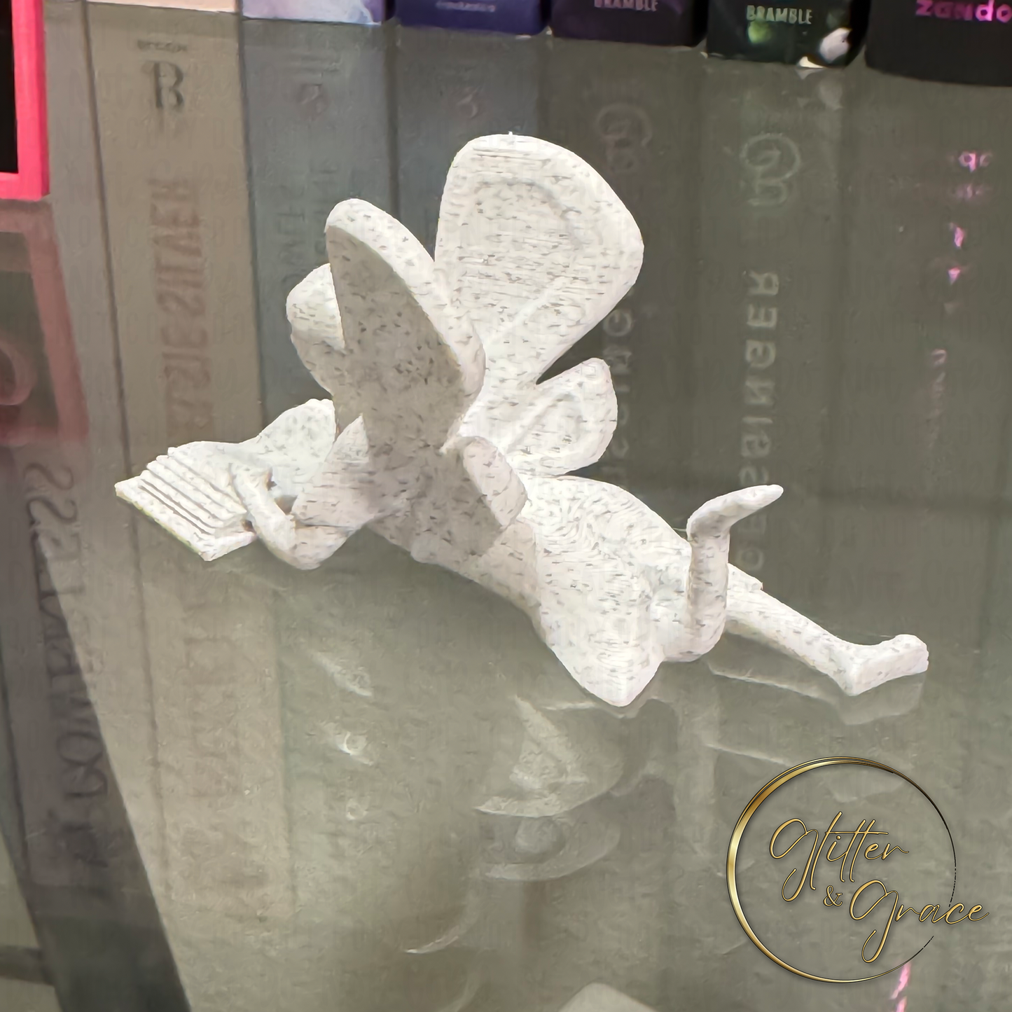 3d printed figurine of a fairy reading a book