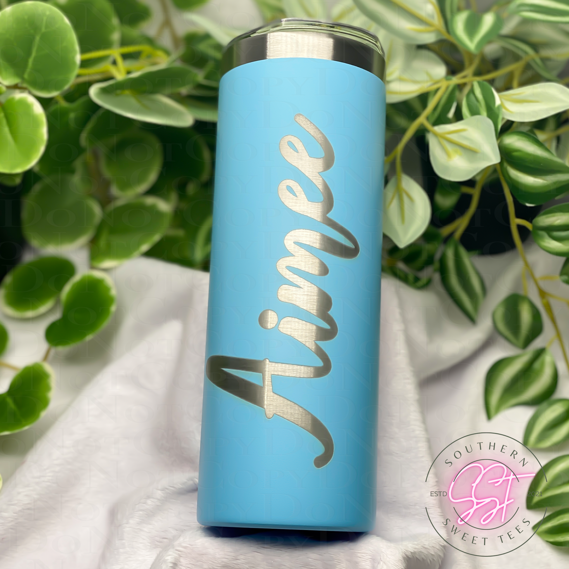 20oz skinny powder coated tumbler in sky blue color laser engraved with a fairy and moon personalized on the back with a name