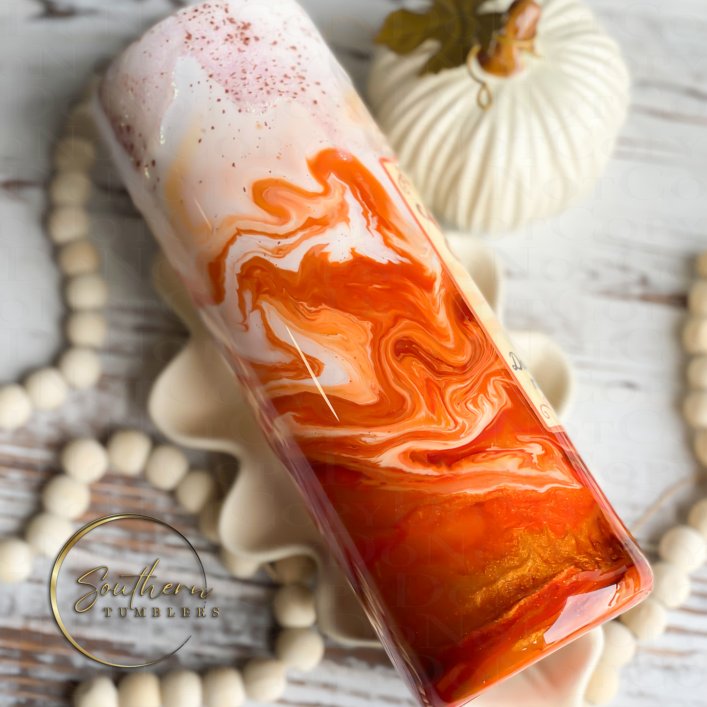 20oz Skinny straight tumbler decorated with glitter and saying tis the season for pumpkin spice lattes topped with a whipped cream drip effect