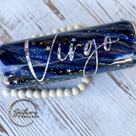 20oz skinny straight tumbler decorated with sapphire blue and black mica powder holographic glitter vinyl and stars saying virgo as the zodiac sign